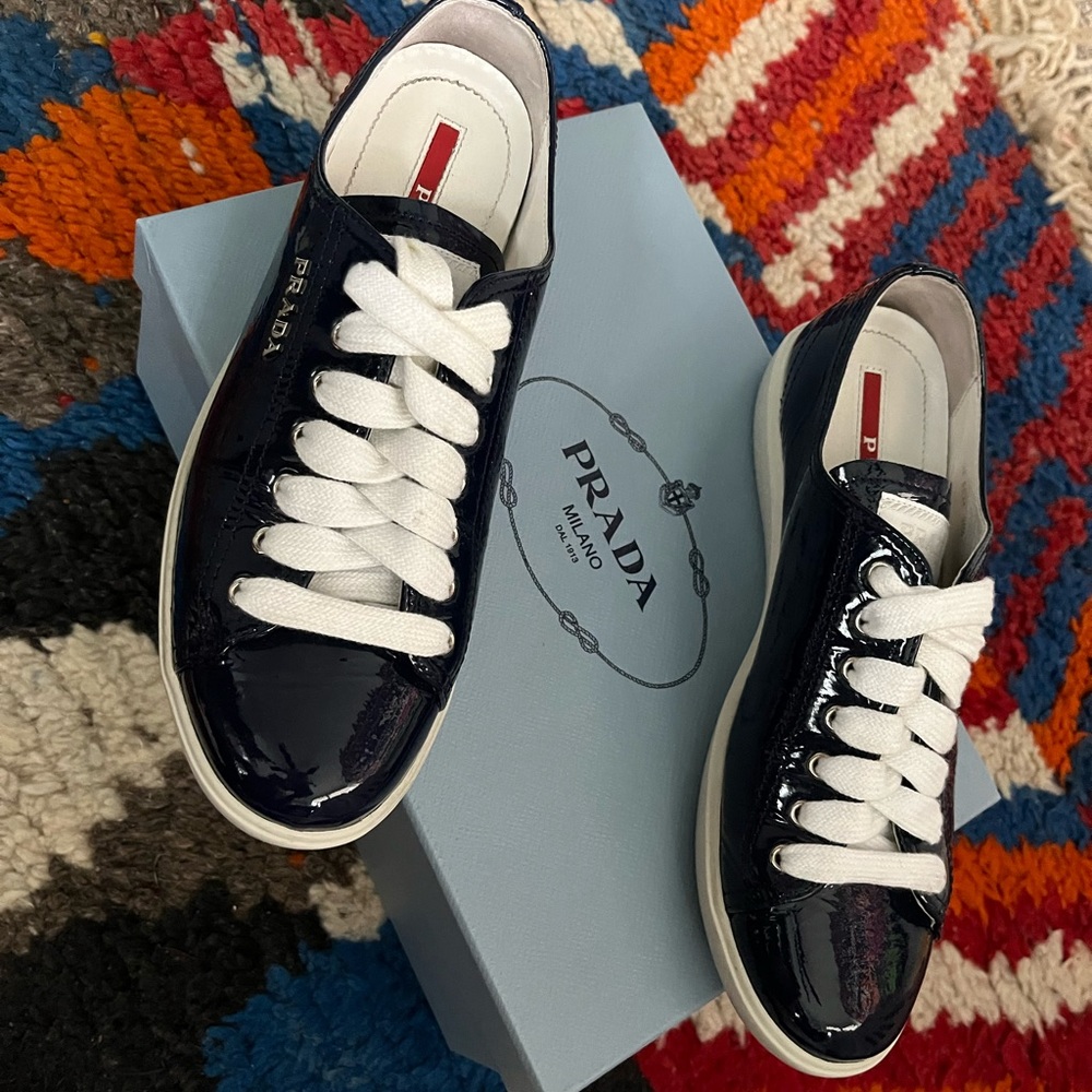 PRADA Sport Patent Leather Sneakers in Navy Blue.